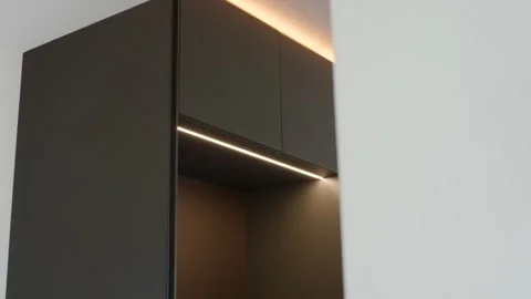 Dark Kitchen Cabinets with Warm LED Strip Lighting, Interior Design, Close Up Stock Footage 341567059