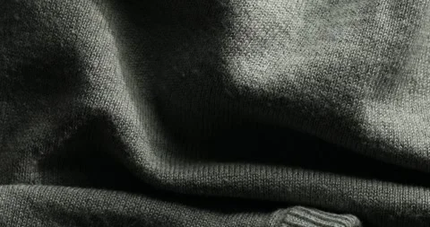 Dark Knitted Fabric Close-Up with Ribbed Detail Stock Footage 294163223