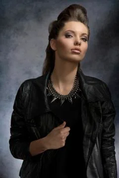 Dark lady with leather jacket Stock Photos