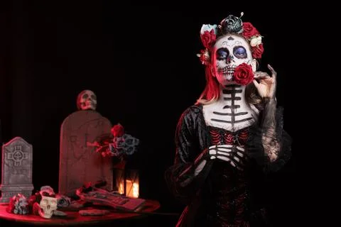 Dark lady posing with red rose during Dia de los Muertos Stock Photos