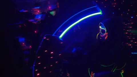 A dark laser show, performer riding a wheel Stock Footage 108569637
