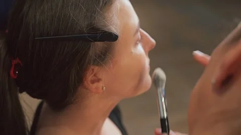 Dark lashes are curled and coated with mascara. Eyes widen with definition Stock Footage 308468866
