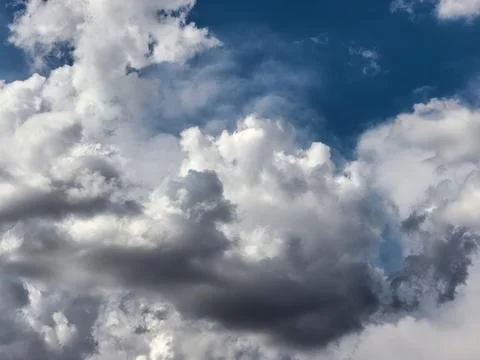 Dark Layered Cumulus Clouds Gathering in Summer Sky Stock Photos