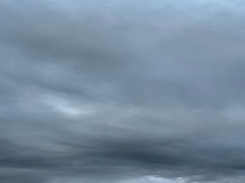 Dark Layered Rain Clouds Across Horizon 写真素材