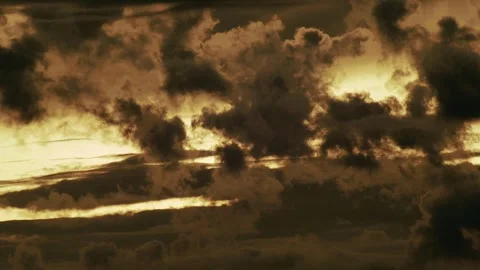 Dark Layered Storm Front Backlit by Setting Sun Видео 337527156