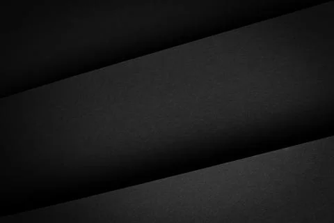 Dark layered surface showing shadows and textures with sharp lines in a sim.. Stock Photos