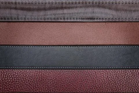 Dark leather belts close-up texture background Stock-Fotos