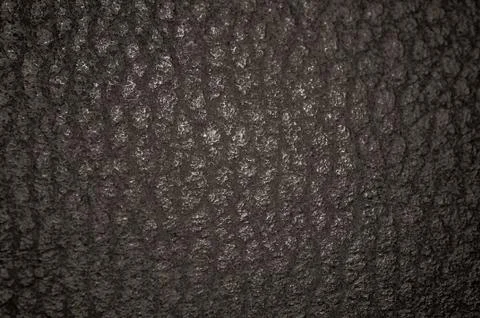 Dark leather texture closeup to use as background Stock Photos