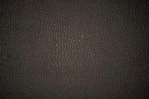 Dark leather texture closeup to use as background Stock Photos