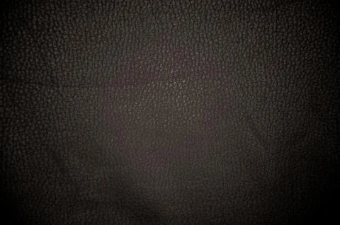 Dark leather texture closeup to use as background Stock Photos