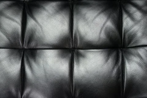 Dark leather texture of sofa closeup shot Stock Photos