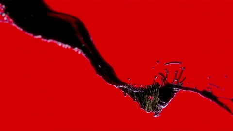 Dark liquid on a red background, slow motion, 3D rendering Stock Footage 166140926