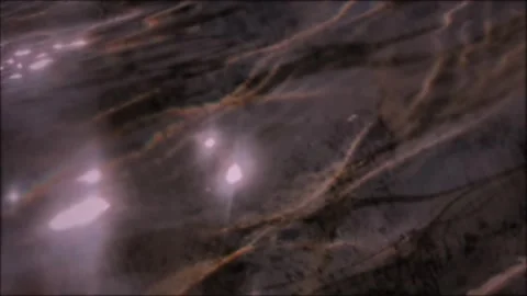 Dark liquid water ripple texture with shimmering light reflections, fluid m.. 動画素材 346659320