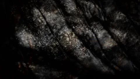 Dark liquid water surface with light ripples and grainy texture, mystical f.. 動画素材 346659324