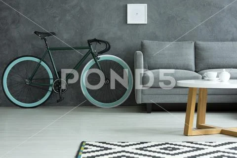 Dark living room with bike Stock Photos