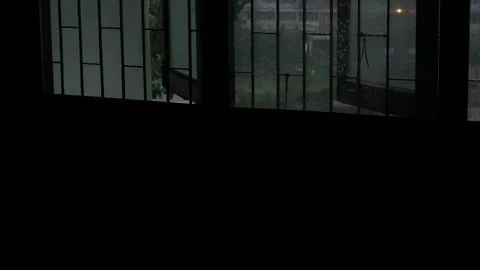 Dark Lonely Rainy Day View Through Old Window Bars with Rain Droplets Stock Footage 339518284