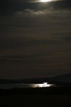 Dark looking landscape with sun Stock Photos