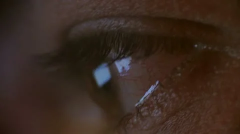 Dark macro close up of human eye watching computer screen Stock Footage 18192271