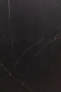 Dark marble surface with intricate veining pattern enhancing modern interior 스톡 사진