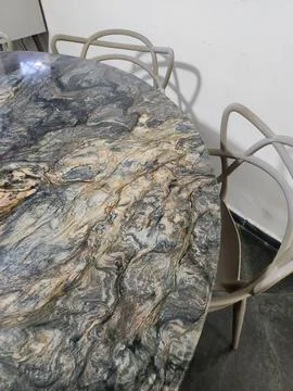 Dark marble table with light chairs Stock Photos