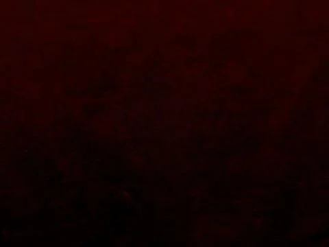 Dark maroon grunge texture enveloping shadowy depths with subtle noise for dr Stock Photos