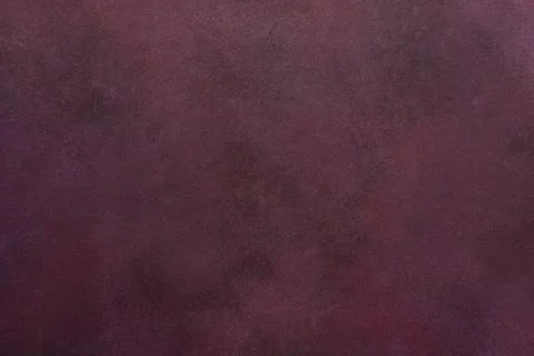 A dark maroon surface exhibits a subtle texture. Light and dark variations .. Foto stock