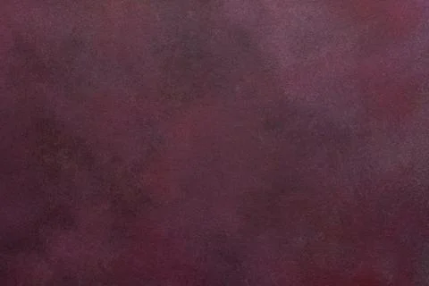 A dark maroon surface exhibits a subtle texture. Light and dark variations .. Foto stock