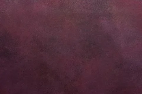 A dark maroon surface exhibits a subtle texture. Light and dark variations .. Foto stock