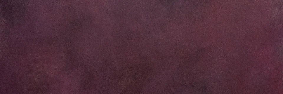 A dark maroon surface exhibits a subtle texture. Light and dark variations cr Stock Photos