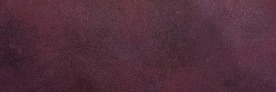 A dark maroon surface exhibits a subtle texture. Light and dark variations cr Stock Photos