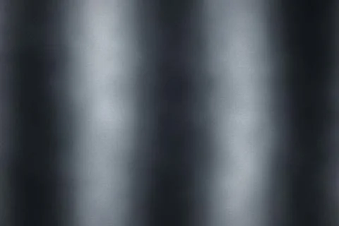 Dark metallic silver gradient texture with vertical highlights and subtle g.. Stock Photos