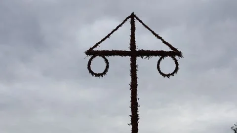 Dark midsummer pole at cloudy evening. Nora, Bergslagen, Sweden. Stock Footage 315246955