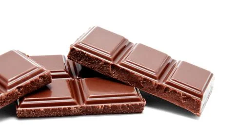 Dark milk chocolate bars stack isolated on a white Foto stock