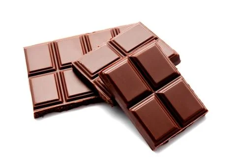 Dark milk chocolate bars stack isolated on a white Stock Photos