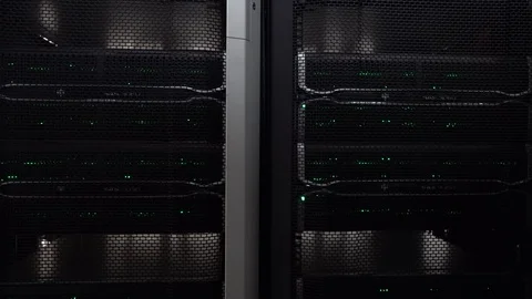 Dark modern working data servers with flashing LED green lights. Video stock 108610052
