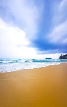 Dark monsoon storm clouds over tropical beach turquoise waves Kata Noi Beac.. Stock Photos