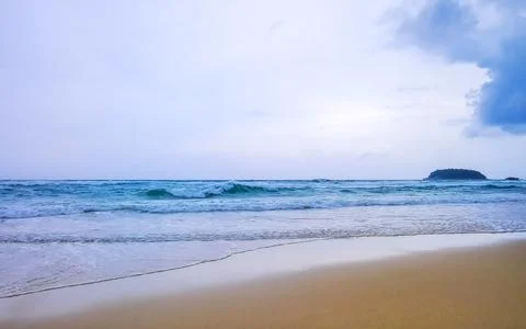 Dark monsoon storm clouds over tropical beach turquoise waves Kata Noi Beac.. Stock Photos