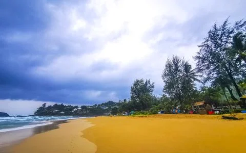 Dark monsoon storm clouds rain over Kata Noi Beach Thailand Stock Photos