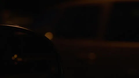 Dark, moody driving POV from inside a car at night, blurred dashboard Stock Footage 280186106