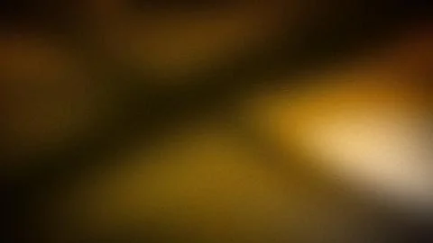 A dark, moody gradient background with deep shades of brown and gold, featu.. Stock Illustration