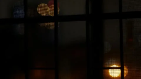 Dark moody night view through window mesh screen 库存影片 336435362