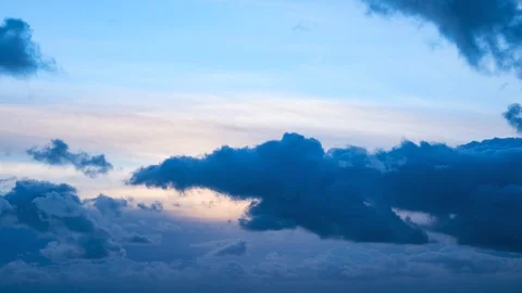 Dark, moody storm clouds moving slowly across sky at dusk Stock Footage 105926347