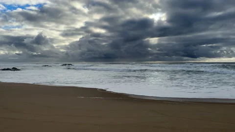 Dark, moody storm clouds over the ocean in spring in Portugal Stock Footage 237753776