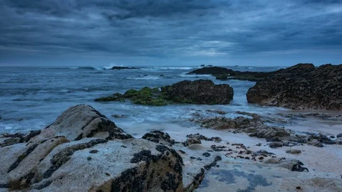 Dark, moody time lapse with dramatic clouds at dusk on beach Stock Footage 109139897
