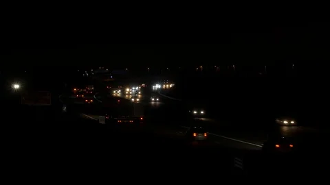 Dark Motorway with bright headlights Stock Footage 101891184