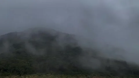 Dark Mountain Slopes Shrouded in Heavy Fog Video stock 341320397