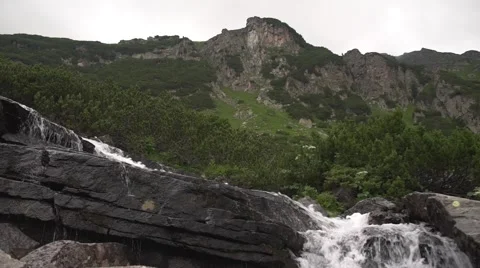 Dark Mountain Spring Flowing HD Stock Footage 66561015