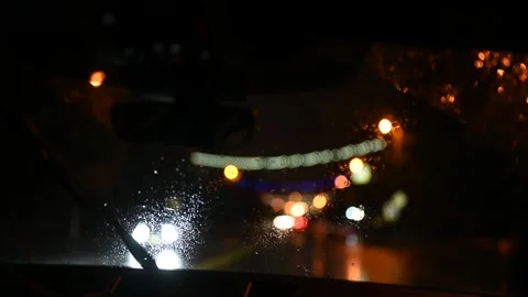 Dark night road view from the car. Shaky footage of unfocused street lights 動画素材 167800973