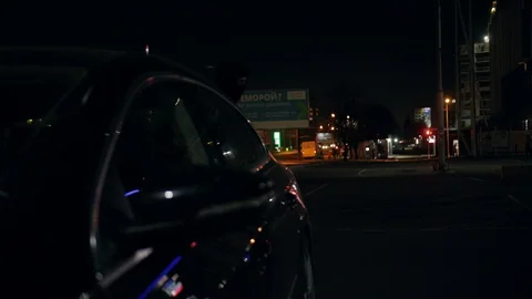 Dark night robber man checking breaking entering alarm shines a flashlight in a Vídeos de archivo 110889780