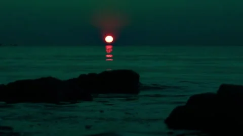 Dark Night Sunset At The Sea. Red Sun Goes Down And Birds Fly Away Stock Footage 168174074